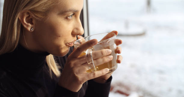 istock Young girl enjoying her tea in restaurant. 1139273077