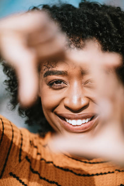 istock Natural Beauty Portrait With Womans Finger Frame 1139274975