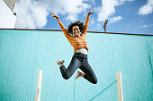 Celebrating Woman Jumps Into The Air