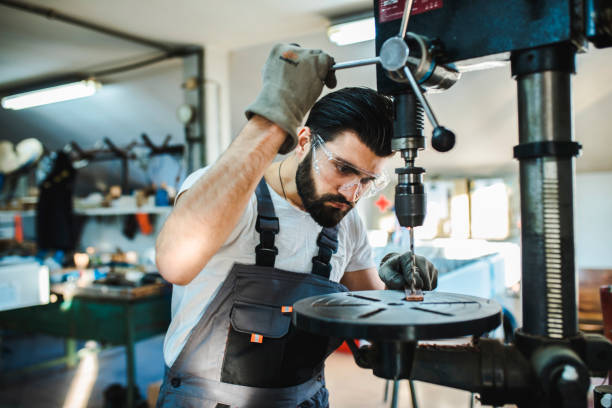 istock Industrial engineer at the lathe machine 1139276444