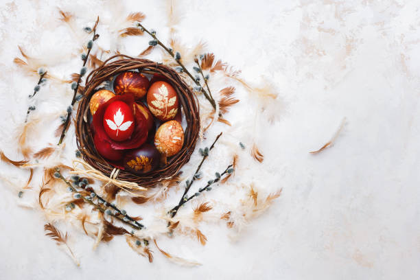 Easter Eggs In Basket,  Naturally Dyed with Onion Skins, Flowers and Herbs Easter Eggs In Basket,  Naturally Dyed with Onion Skins, Flowers and Herbs. Top view, blank space, textured background orthodox church easter stock pictures, royalty-free photos & images