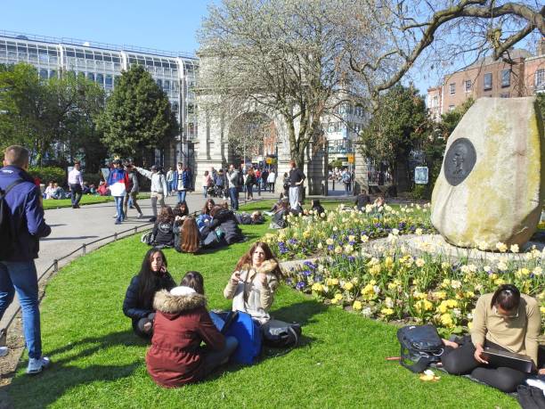 29th March 2019, Dublin, Ireland. People enjoying a hot sunny day in St Stephen's Green city centre public park in Dublin.