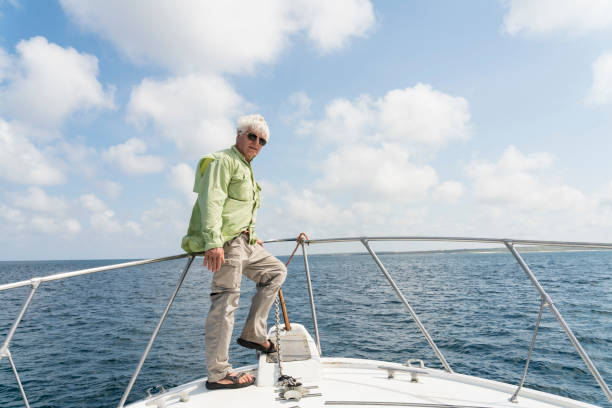 istock Senior man on the boat in Galapagos 1139279982