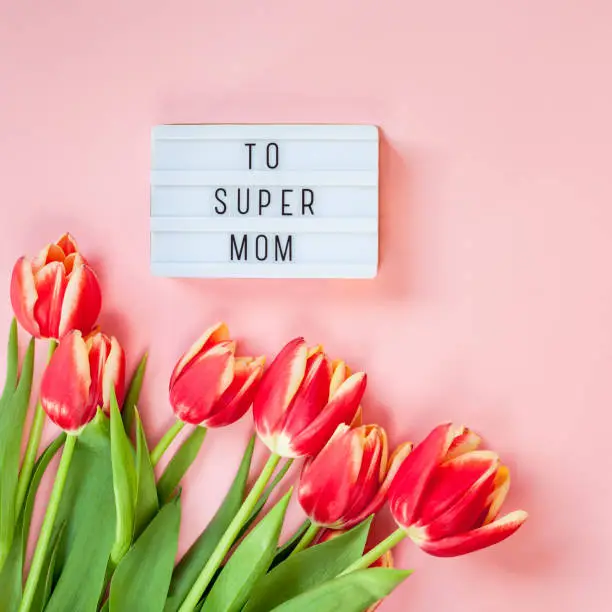 Photo of Mothers Day greeting card with red tulip flowers