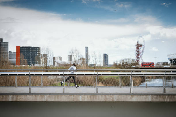 istock African runner jogging on the cloudy cold day. 1139284755