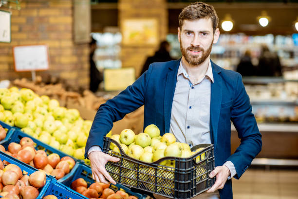 istock Man with apples in the supermarket 1139292895