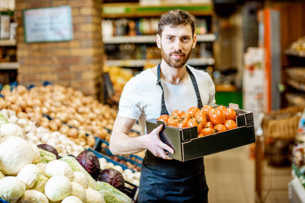 istock Worker with vegetables in the supermarket 1139293251