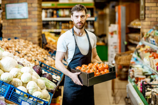 istock Worker with vegetables in the supermarket 1139293270