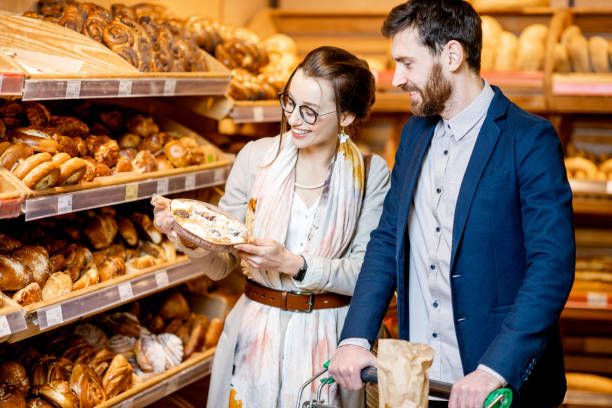 istock Couple choosing bakery in the supermarket 1139295724