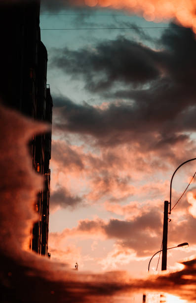 istock Creative photography of cloudy sunset sky which is reflected in a puddle. 1139299357