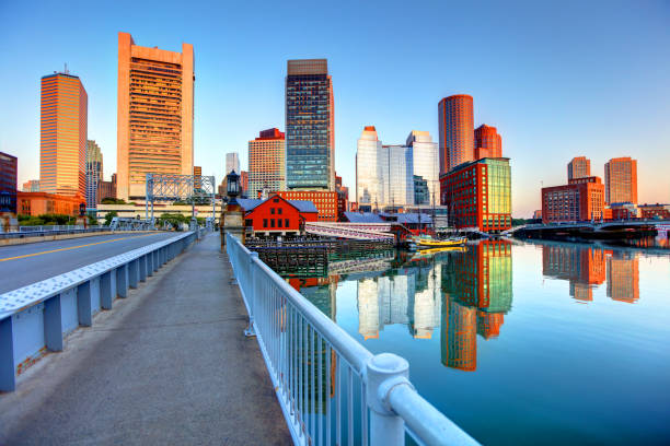 Boston skyline along Fort Point Boston is known for its central role in American history, world-class educational institutions, cultural facilities, and champion sports franchises boston harbor stock pictures, royalty-free photos & images