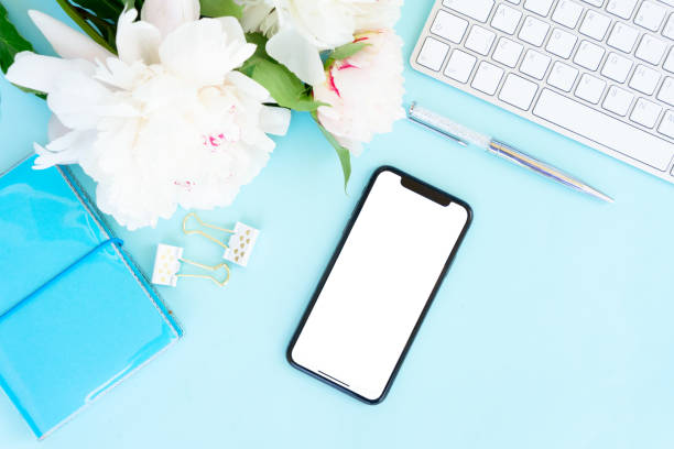 istock Home office desk with phone on blue 1139301450