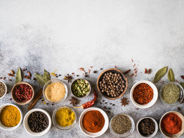 istock Various dry spices flat lay in small bowls on gray background. Top view, copy space 1139303316