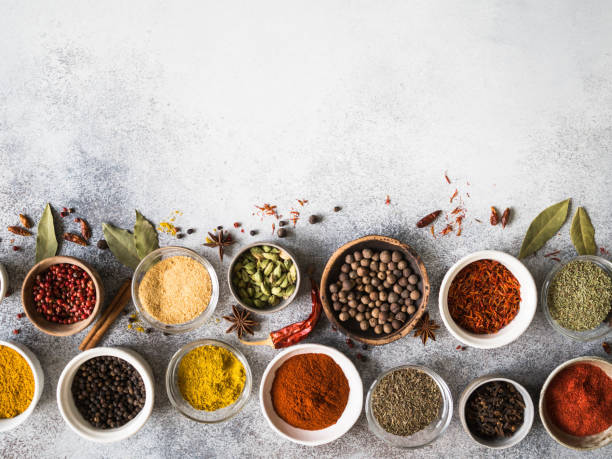 istock Various dry spices flat lay in small bowls on gray background. Top view, copy space 1139303378