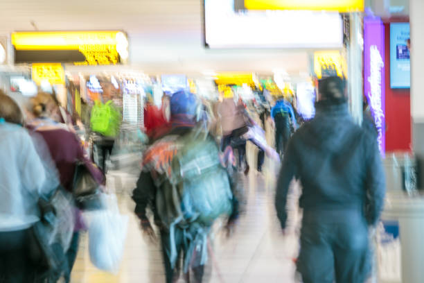 istock Blurred travelers in airport 1139303430