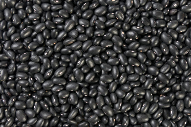 istock black bean texture background. nutrition. food ingredient. 1139306160
