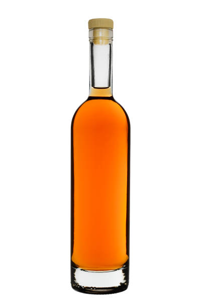 the closed bottle of brandy or rum. isolated on a white background - hard liqueur imagens e fotografias de stock