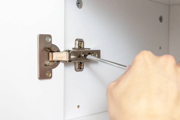 istock Adjustment of furniture doors using a screwdriver, assembling furniture concept 1139313229