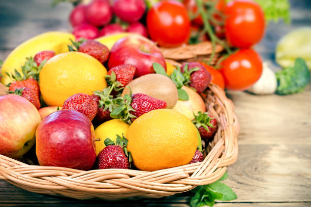 istock Fruit and vegetable in wicker basket, organic food in diet 1139317609