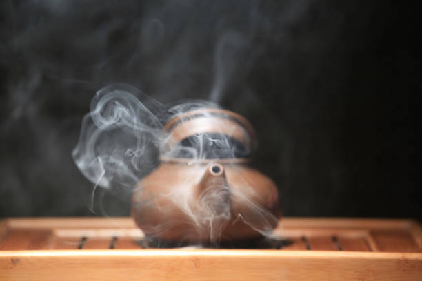 Pouring Black Tea into Cup