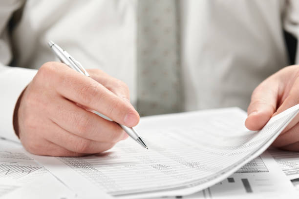 istock Businessman working in an office. Hands and documents closeup. 1139319510