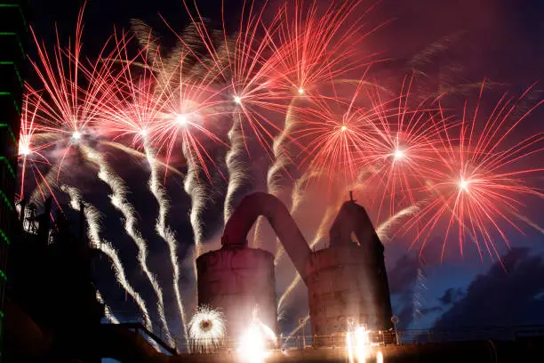fireworks behind a blast furnace and steel mill - its of Duisburg - Germany - an old industry complex