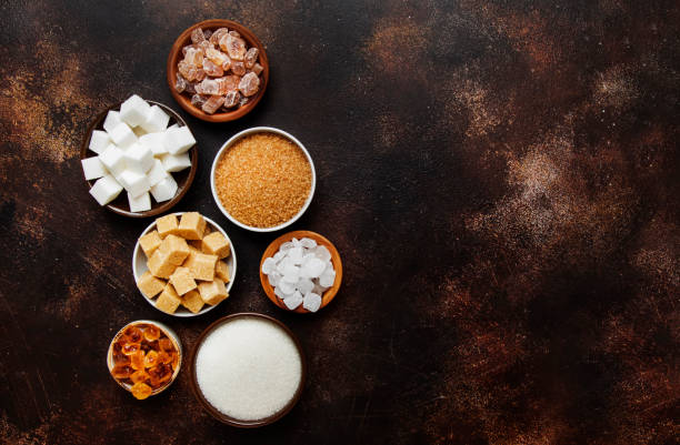 istock Set of different white and brown sugar in assortment, dark background, top view 1139319839