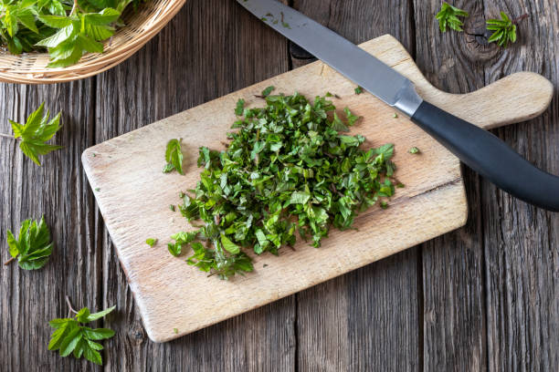 istock Cut-up young ground elder leaves on a cutting board 1139323413