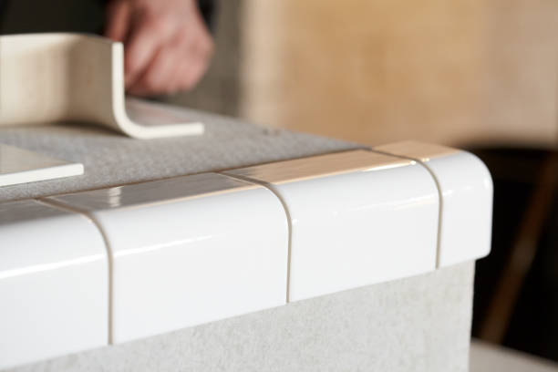 istock Man Tiling New Shop Counter With Unusual Ceramic Tile 1139324249