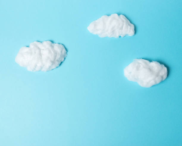 istock White cotton clouds on pastel blue background. Minimal concept. 1139324861