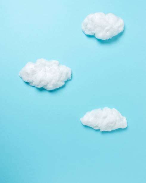 istock White cotton clouds on pastel blue background. Minimal concept. 1139324862