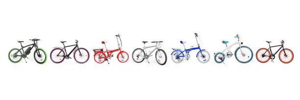 Different bikes collection. Set of electric, urban, cruiser, MTB and folding bikes placed in single line. isolated on white, clipping path included