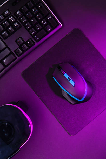 istock Top view a gaming gear, mouse, keyboard, joystick, headset, VR Headset on black table background. 1139327086