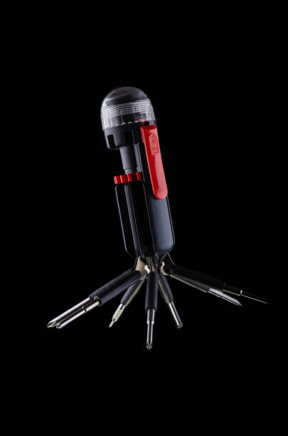 istock Multifunctional tool for screws and bolts on a black background. 1139328172