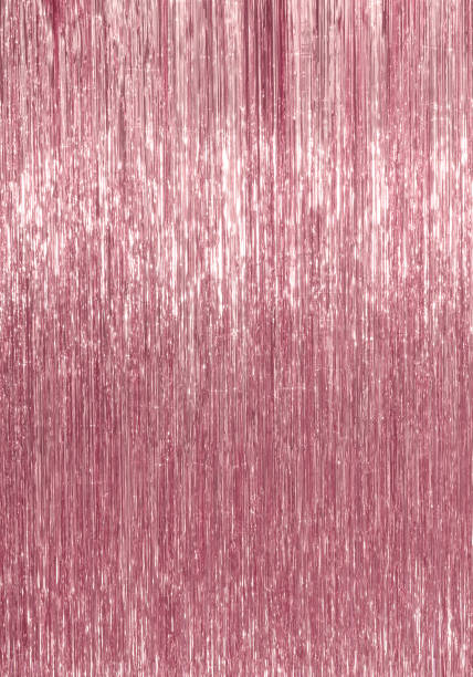 istock pink, rose Christmas tinsel background Christmas lights background 1139328283