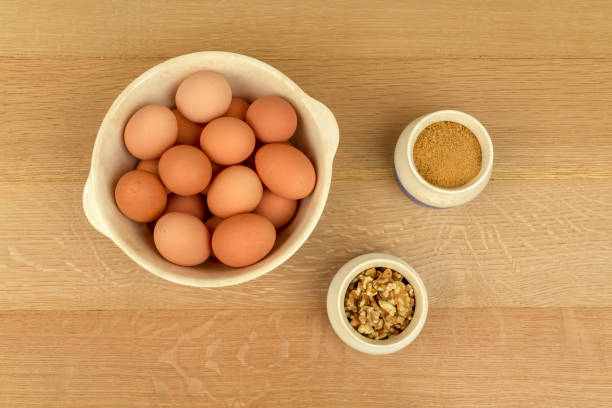 Eggs, Walnuts, Organic Sugar, Cinnamon, in Blue and White Bowls.