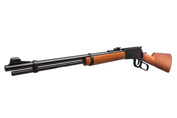 istock Old American wild west rifle isolated on white background 1139330576