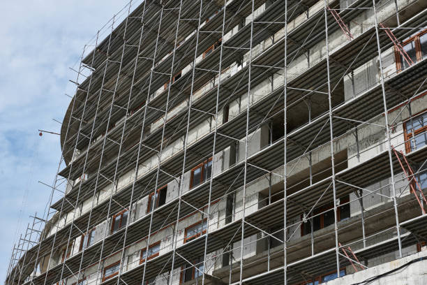 istock new building under construction, scaffolding and concrete 1139333902