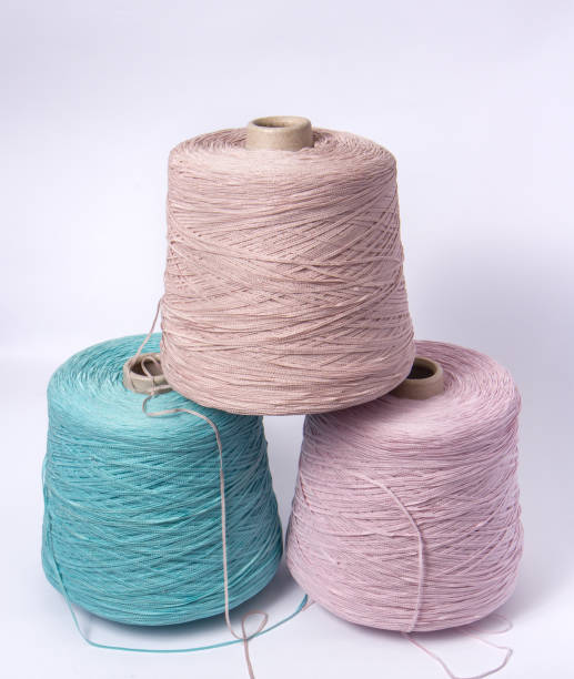 istock Bobbins of yarn on a white background. Side view.Textile reels on isolated white background. 1139334112