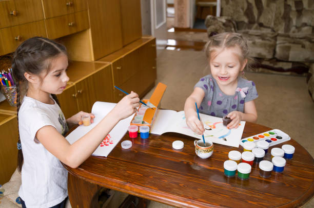 istock Kids painting at home 1139336645