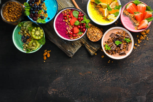 istock Colorful fruit smoothies with yogurt, fresh fruit and berries. Top view. Free space for your text. 1139338548