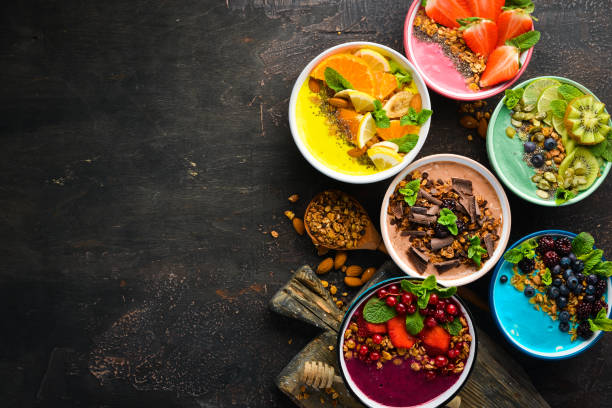 istock Colorful fruit smoothies with yogurt, fresh fruit and berries. Top view. Free space for your text. 1139338562