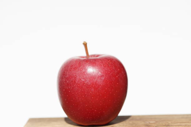 istock Single red Apple on sunny day in macro 1139339986