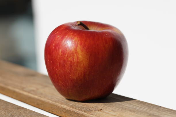 istock Single red Apple on sunny day in macro 1139340013