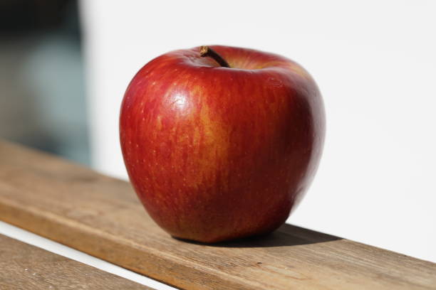 istock Single red Apple on sunny day in macro 1139340078