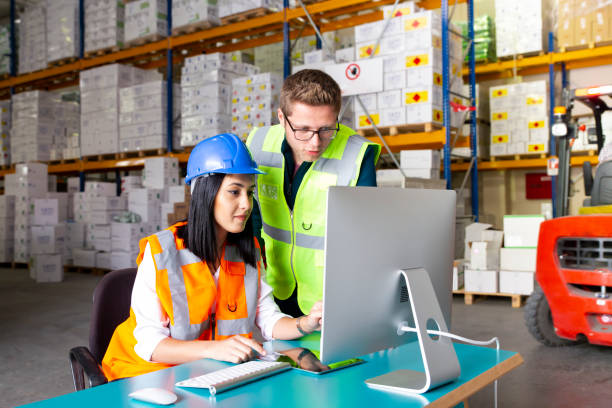 istock Business colleagues working with computer in warehouse 1139342431