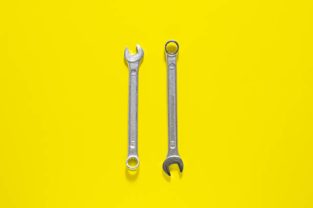 istock Spanner key on yellow  background. Screw driver set. Wrench spanners.  Background for your text and design. 1139343949