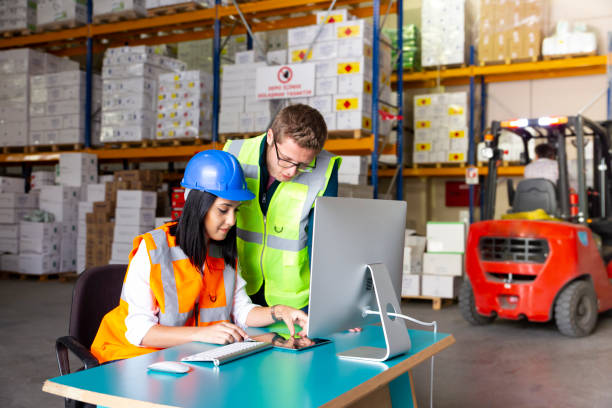 istock Business colleagues working with computer in warehouse 1139344395