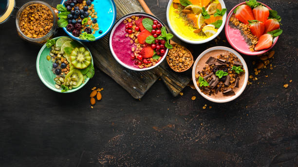 istock Colorful fruit smoothies with yogurt, fresh fruit and berries. Top view. Free space for your text. 1139344515