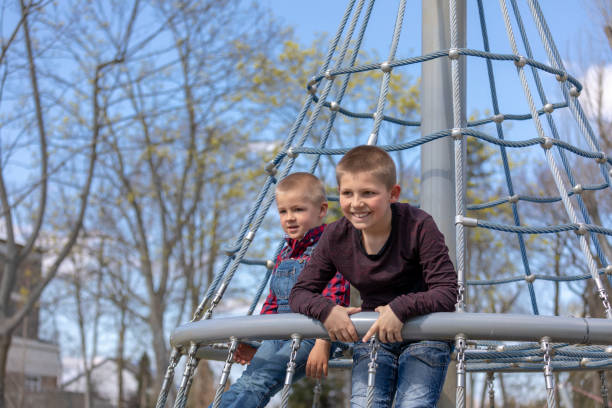 istock Little boys in cap climb 1139345219